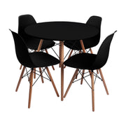 Comedor Redondo Tapa Negra más 4 sillas DKR Tipo Eames Negras
